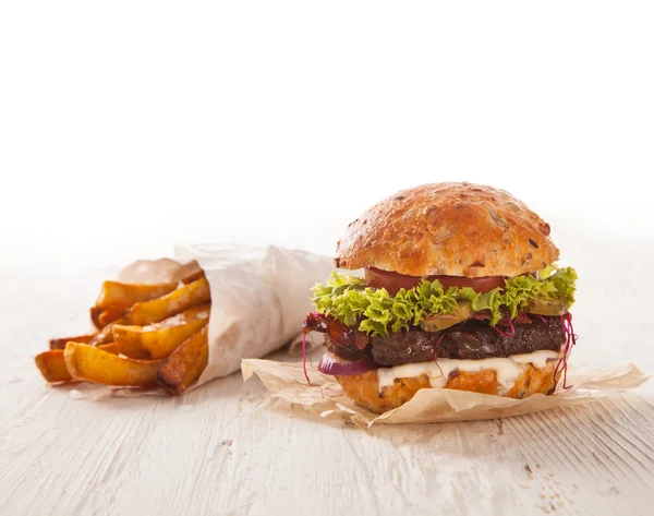 Delicious hamburger on wood — Stock Photo, Image