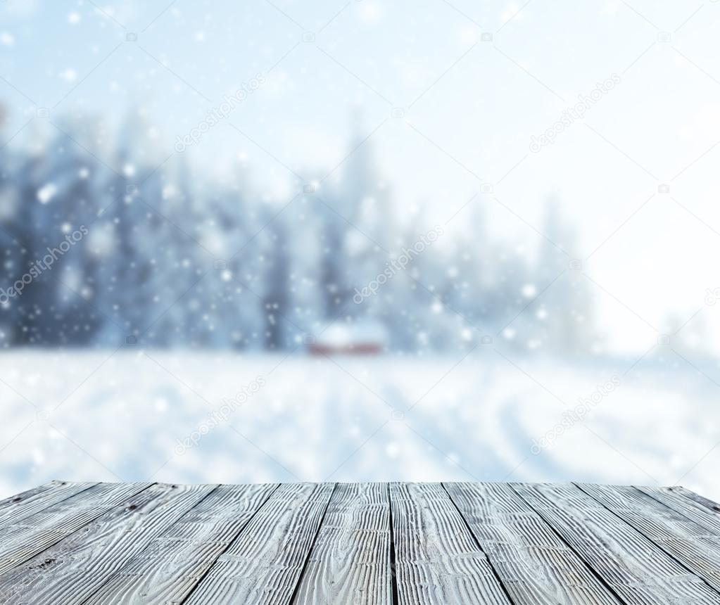 Winter landscape with wooden planks