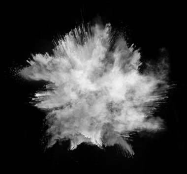 Freeze motion of white dust explosions on black background