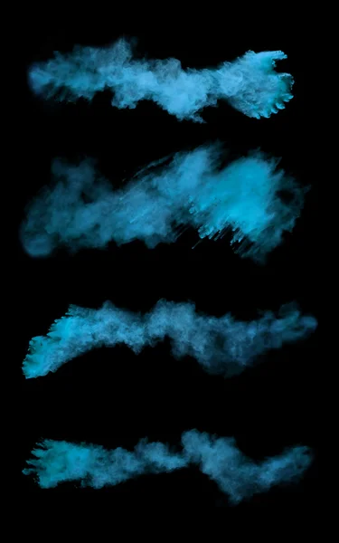 Freeze motion of blue dust explosions on black background — Stok fotoğraf