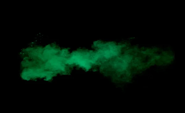 Freeze motion of green dust explosion on black background — ストック写真