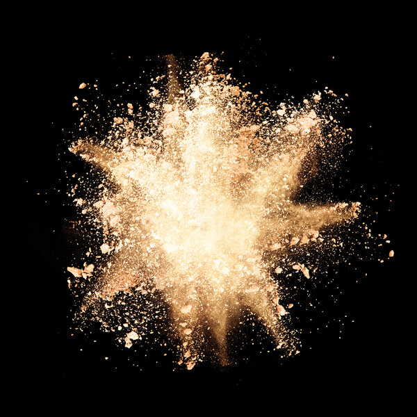 Freeze motion of yellow dust explosions on black background