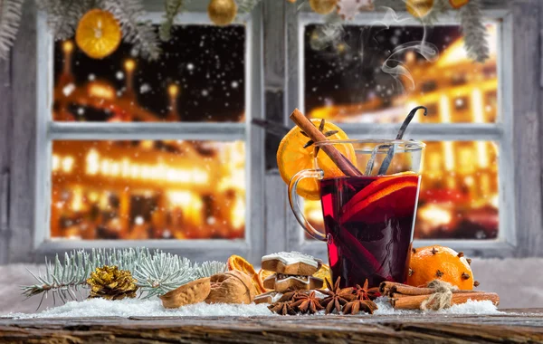 Hot red wine drink on wooden table — Stock Photo, Image