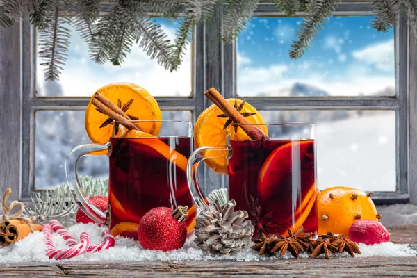 Hot red wine drinks on wooden table — Stock Photo, Image