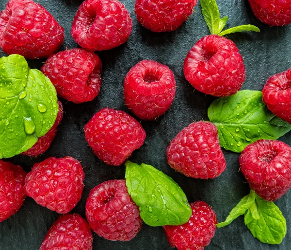 Heap of raspberry on stone — Stock Photo, Image