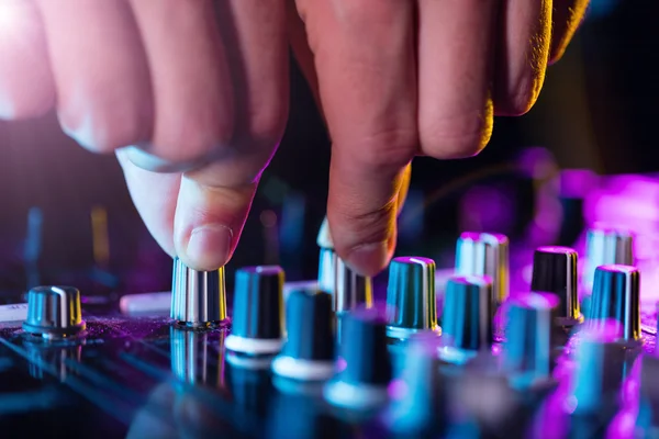 DJ turntable console mixer controlling with two hands — Stock Photo, Image