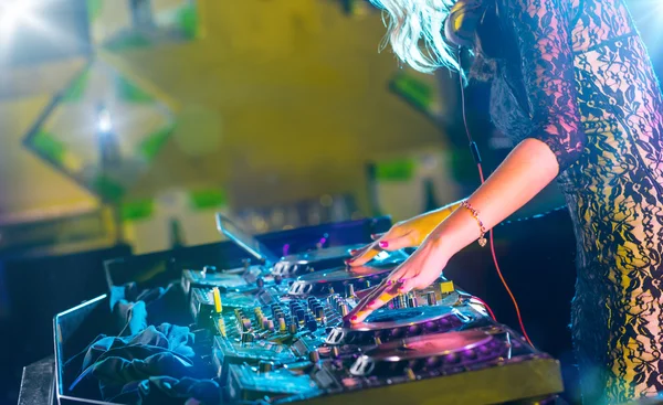 DJ turntable console mixer controlling with two hands — Stock Photo, Image