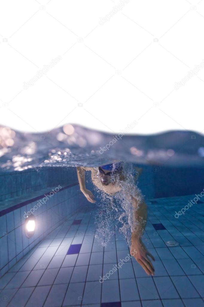 Young man swimming in pool, free space for text