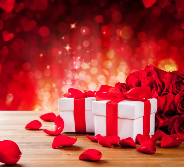 Valentines gift boxes on abstract red background — Stock Photo, Image