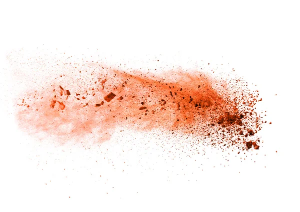 Explosion von orangefarbenem Pulver auf weißem Hintergrund — Stockfoto