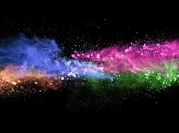 Explosion av färgat pulver på svart bakgrund — Stockfoto