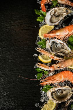 Seafood served on black stone clipart