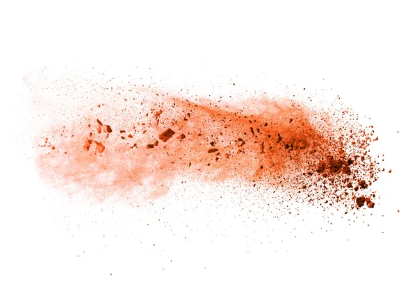 Explosion von orangefarbenem Pulver auf weißem Hintergrund — Stockfoto