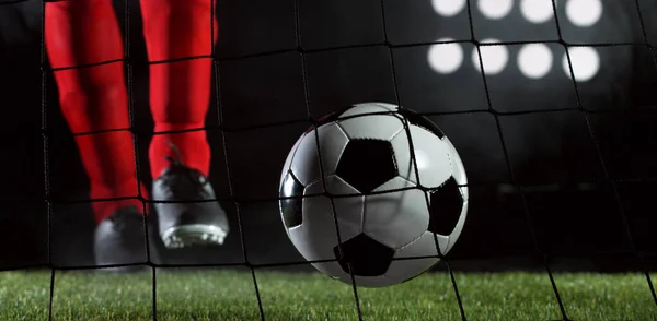 Kicking Soccer Ball Into Net Goal Success Concept Isolated On Black Background Dark Season Stock Photo