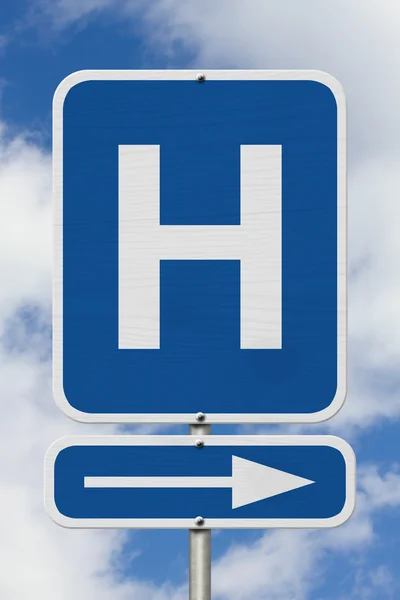 Hierlangs naar het ziekenhuis-teken — Stockfoto