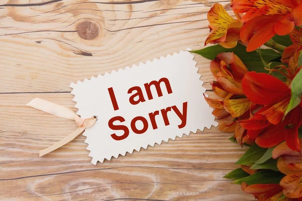 Es tut mir leid Geschenkanhänger mit Blumen — Stockfoto