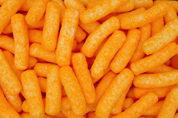 Oranje kaas bladerdeeg Snack achtergrond — Stockfoto