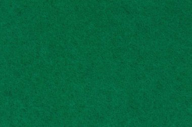Avcı yeşil keçeli malzeme arka planında ileti için kopyalama alanı veya doku olarak kullanılacak 