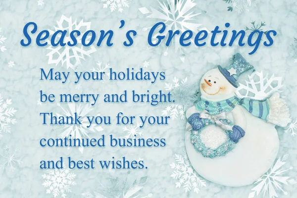 Seasons Greetings message for your customers with a friendly snowman with blue snowflake