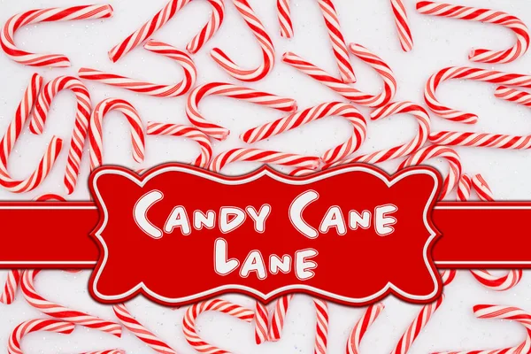 Candy Cane Lane message with candy canes and banner on white sparkle felt