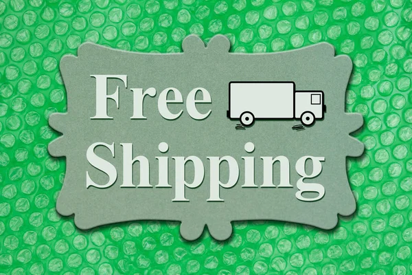 Free Shipping Message Wood Sign Green Bubble Wrap — Stock Photo, Image