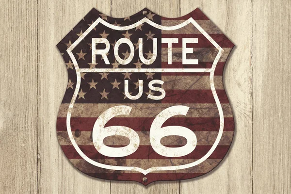 Retro weathered Route US 66 highway sign with USA flag won weathered wood