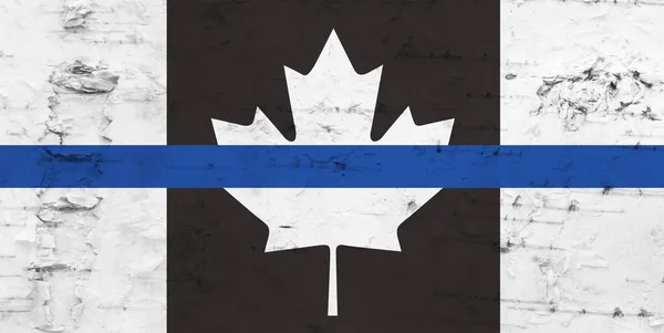 Old Canadian thin blue line flag on weathered whitewash wood