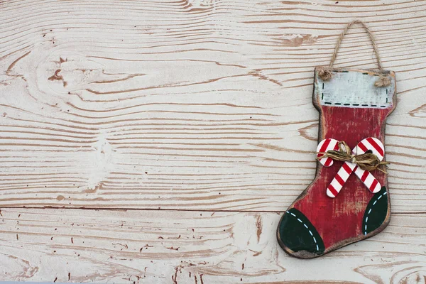 Weihnachten Hintergrund mit einem Strumpf auf Grunge strukturierten Holz bac — Stockfoto