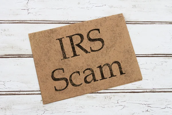 Tarjeta de advertencia de estafa del IRS Imágenes de stock libres de derechos