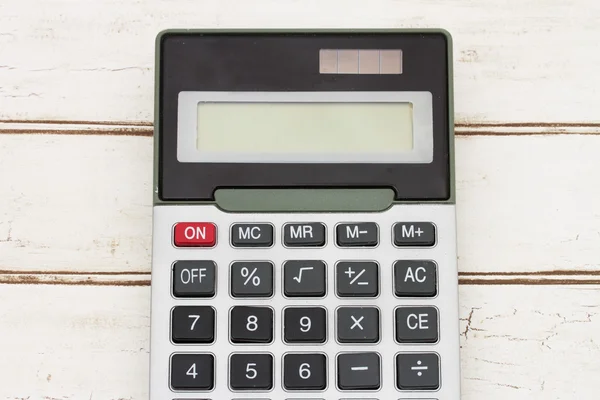 Calculator op hout achtergrond — Stockfoto