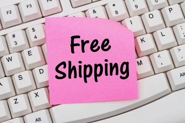 Online shopping med fri frakt, tangentbord och klibbig — Stockfoto