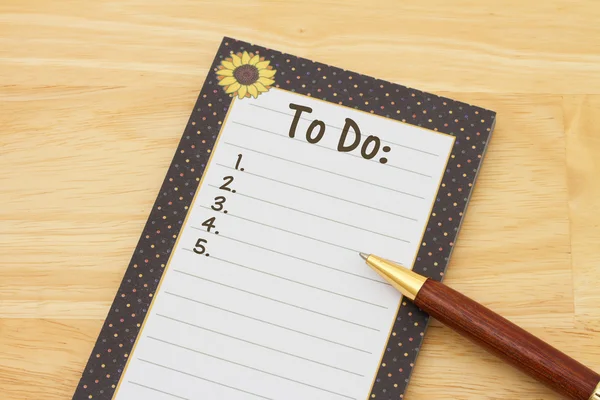 A notepad and pen on a desk with text To Do and copy-space — Stock Photo, Image