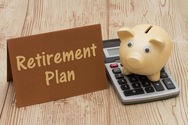 Having a retirement plan, A golden piggy bank, card and calculat