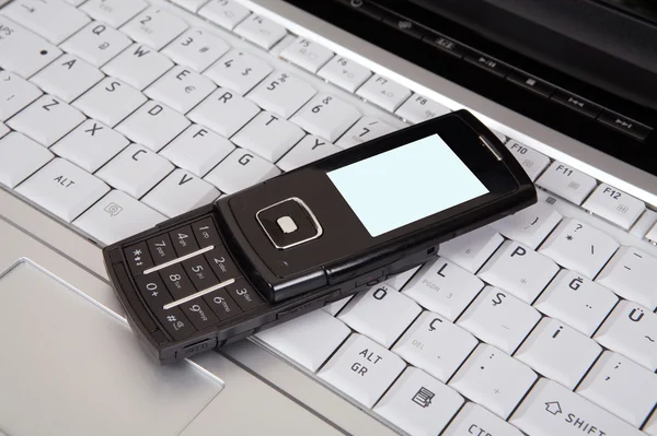 Laptop and mobile phone — Stock Photo, Image