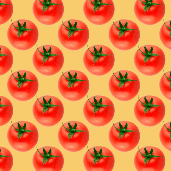 Creative layout of seamless vegetables pattern photo. Whole tomatoes on light yellow background. Collage art. Vegetarian and healthy eating concept. Top view, flat lay.