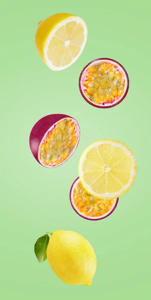 Fresh falling lemon and passionfruits isolated on white — Stock Photo, Image