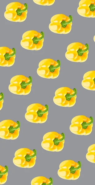 Whole yellow peppers pattern on ultimate gray color background. Minimal flat lay food texture — Stock Photo, Image
