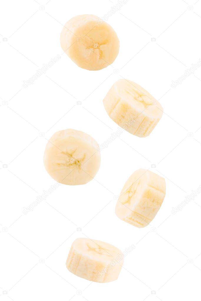 Flying fresh peeled sliced banana fruits on white background