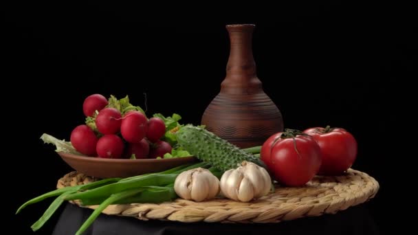 Still life with vegetables on a black background. — Stock Video
