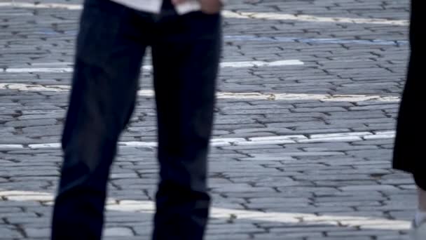 Paving stones on the square on which people are walking. — Stok video