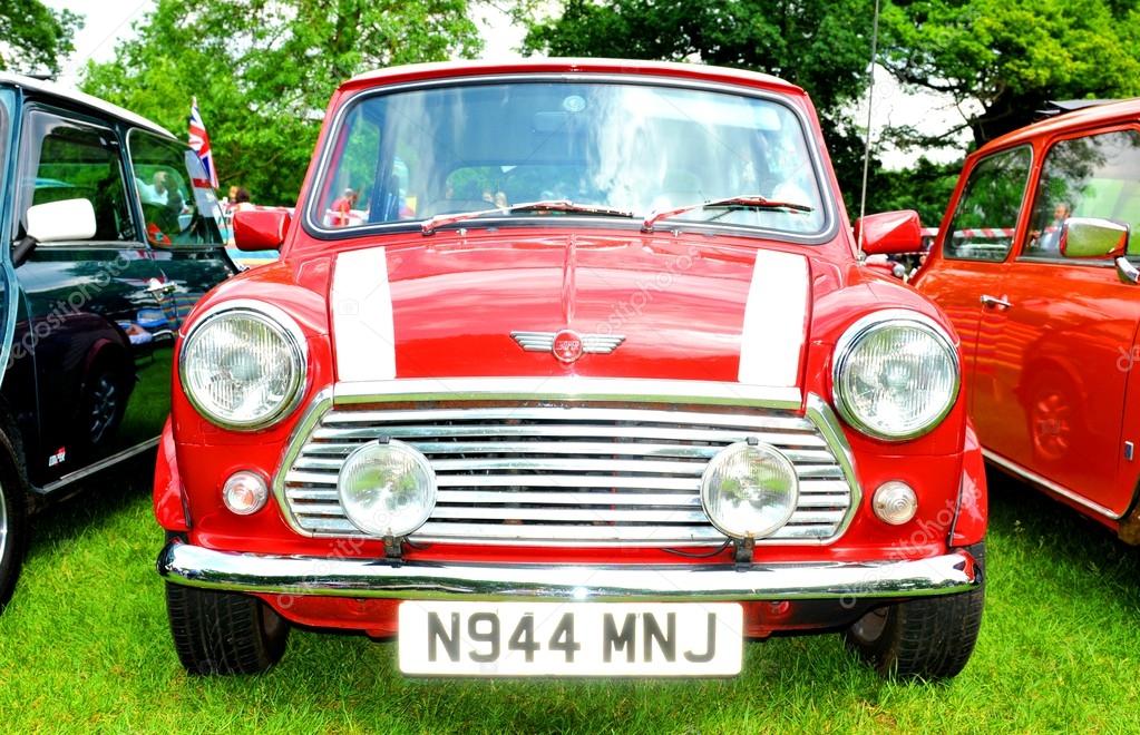 NOTTINGHAM, UK. JUNE 1, 2014: Frontal view of a red Mini Cooper vintage car for sale in Nottingham, England.