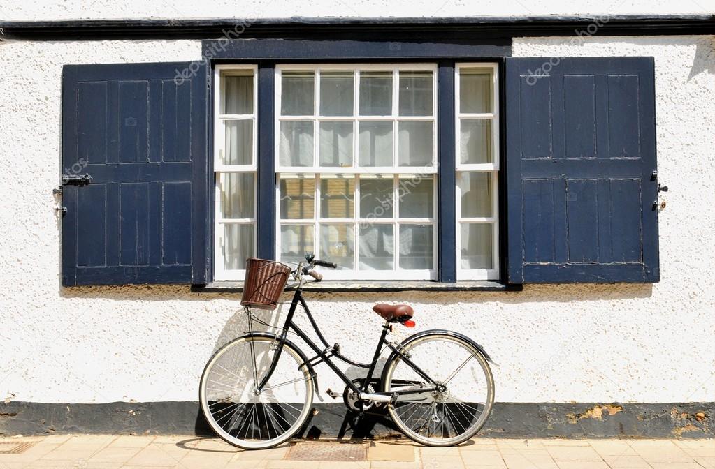 Vintage theme with bicycle against old building Stock Photo by