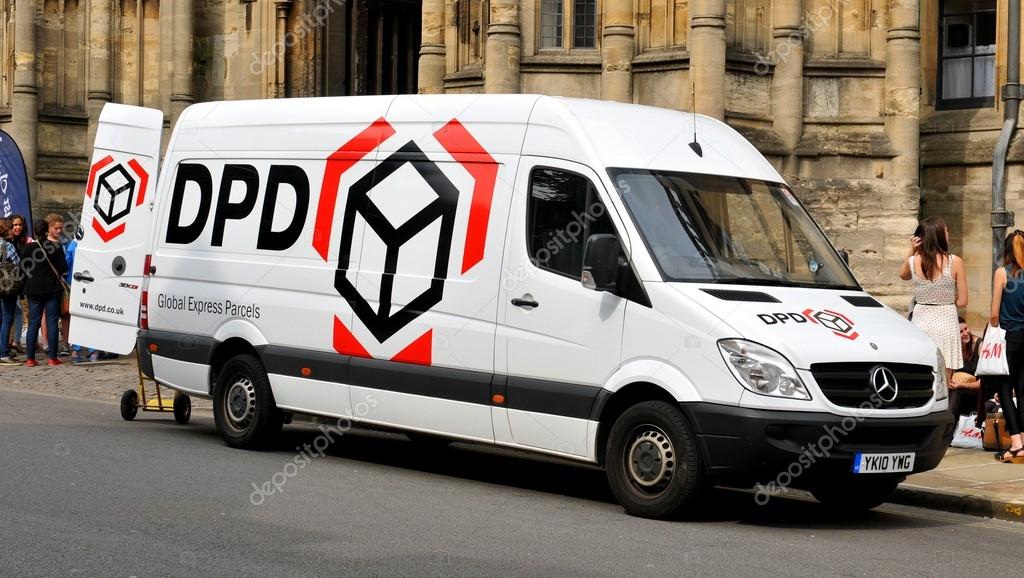 OXFORD, UK - JULY 9, 2014: A white DPD van parked in front of an old building in central Oxford. DPD is a leading provider of parcel delivery services worldwide.