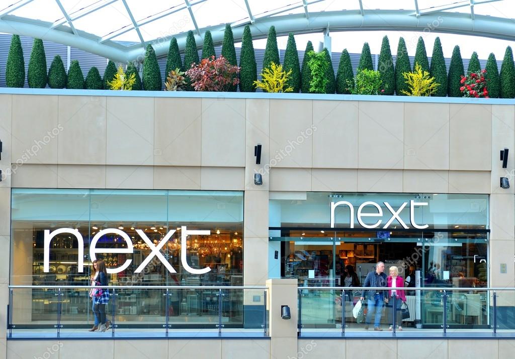 LEEDS, UK - APRIL 17, 2015: Next store inside the Trinity shopping centre in Leeds, England. Next is a famous British multinational clothing, footwear and home products retailer.