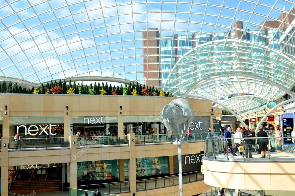 LEEDS, UK - APRIL 17, 2015: Next store inside the Trinity shopping centre in Leeds, England. Next is a famous British multinational clothing, footwear and home products retailer.