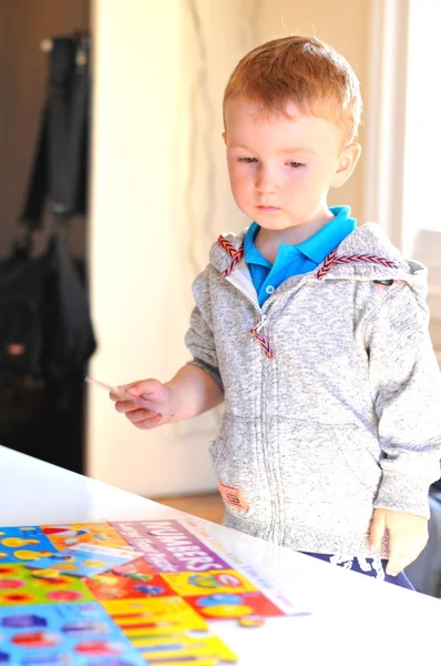 Child with puzzle — Stock Photo, Image