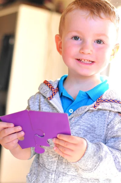 Child with puzzle — Stock Photo, Image