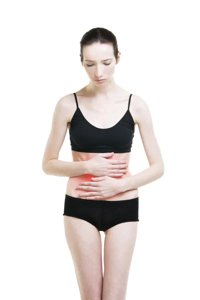 Mujer con dolor abdominal. Dolor en el cuerpo humano aislado sobre fondo blanco — Foto de Stock