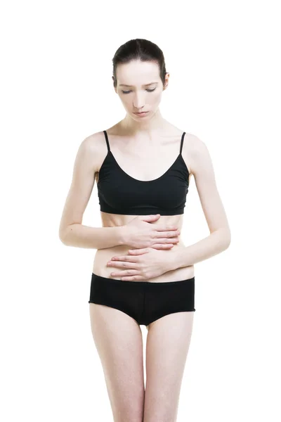 Mujer con dolor abdominal. Dolor en el cuerpo humano — Foto de Stock