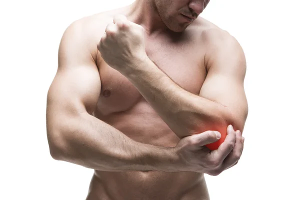 Dolor en el codo. Cuerpo masculino muscular. Guapo culturista posando en el estudio. Aislado sobre fondo blanco con punto rojo —  Fotos de Stock